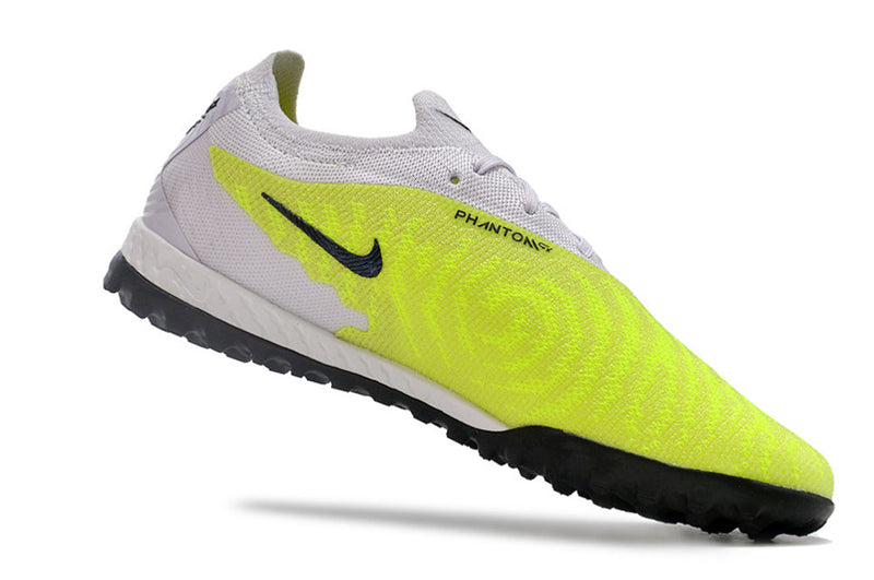 Chuteira Society Nike Phantom GX Elite TF Branca e Verde "Luminous Pack"