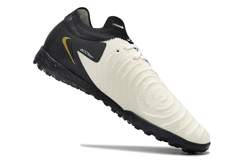 Chuteira Society Nike Phantom GX 2 Elite TF Preta, Branca e Dourada "Mad Ready Pack"